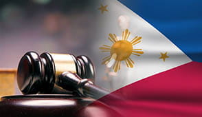 A gavel beside a statue of Lady Justice