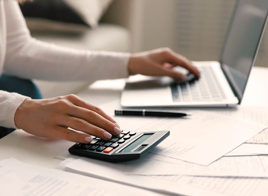 picture-of-a-woman-on-laptop-with-calculator-1.jpg