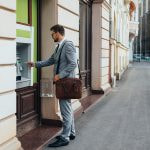 Man withdrawing funds from an ATM