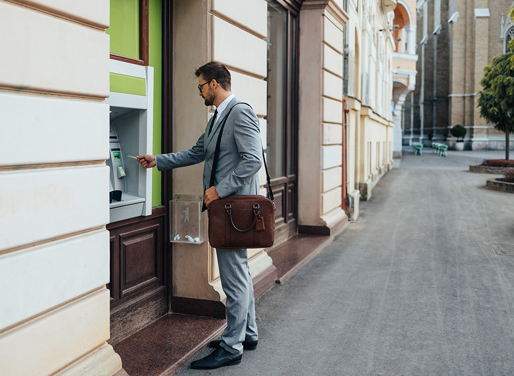 Man withdrawing funds from an ATM