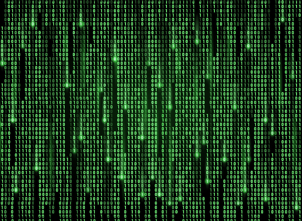 Green source code on black background