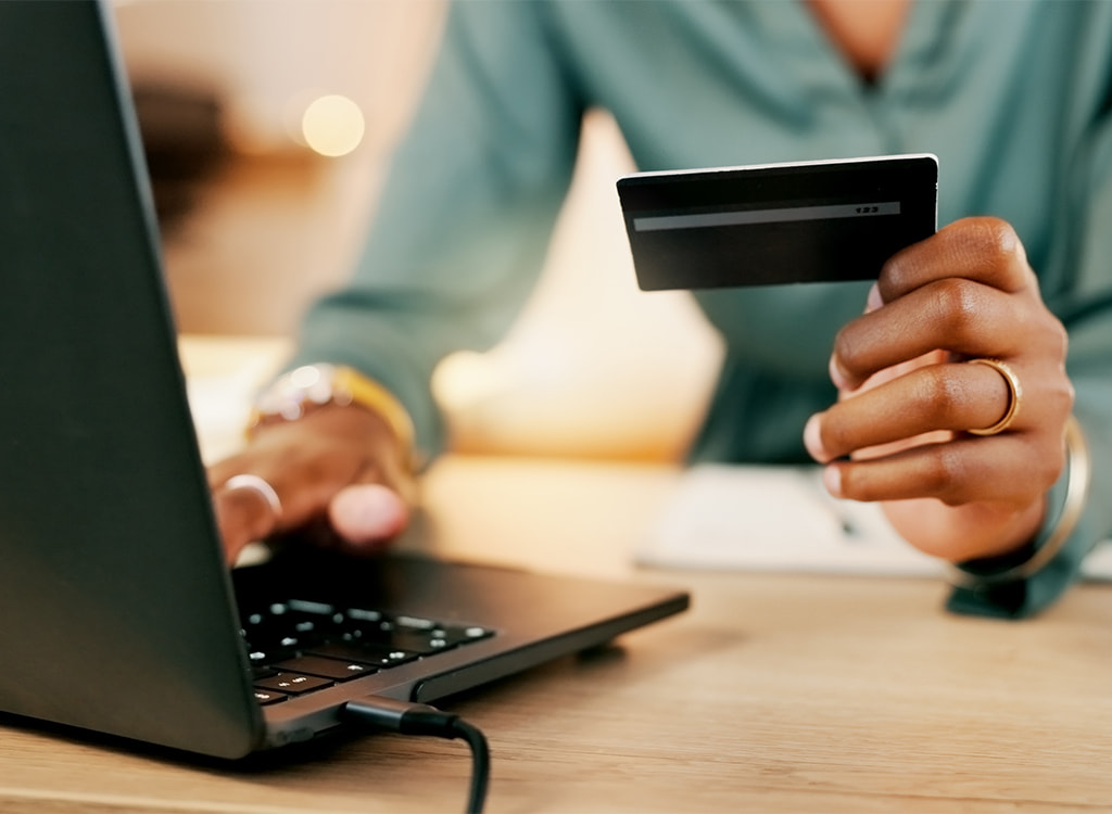 Person making an online payment by card